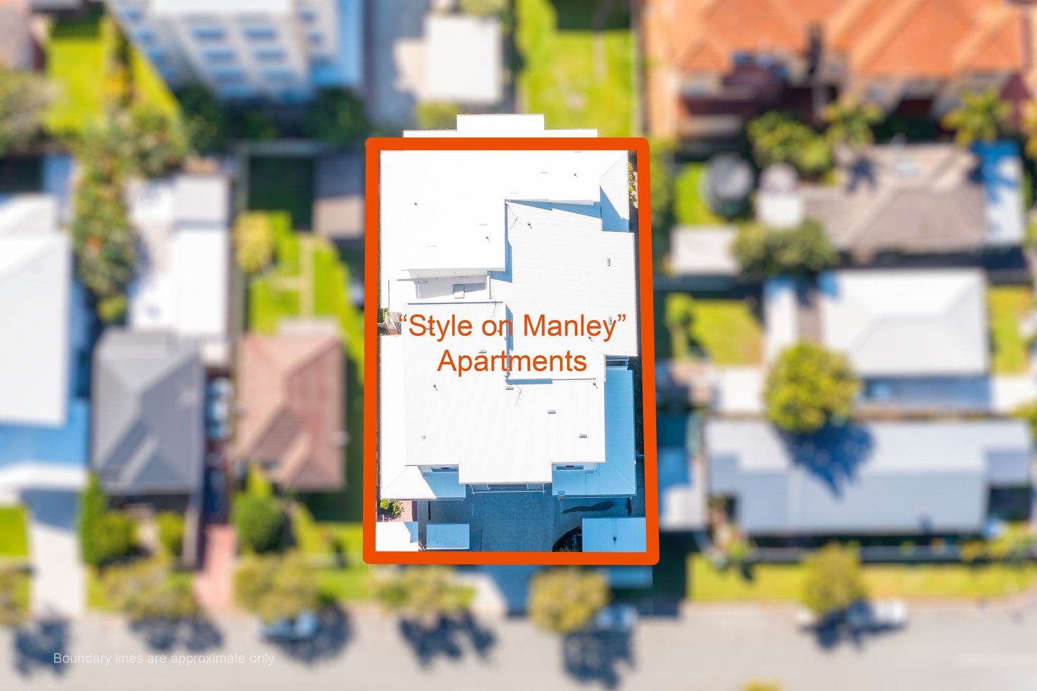 Aerial overhead view of Style on Manley Apartments building highlighted with an orange border in a suburban street.