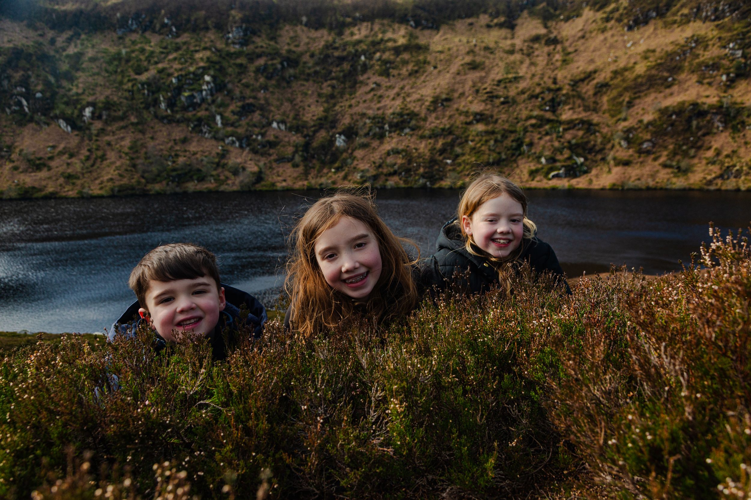 joyful children enjoying their family friendly guided tour of the wicklow mountains, just south of dublin.