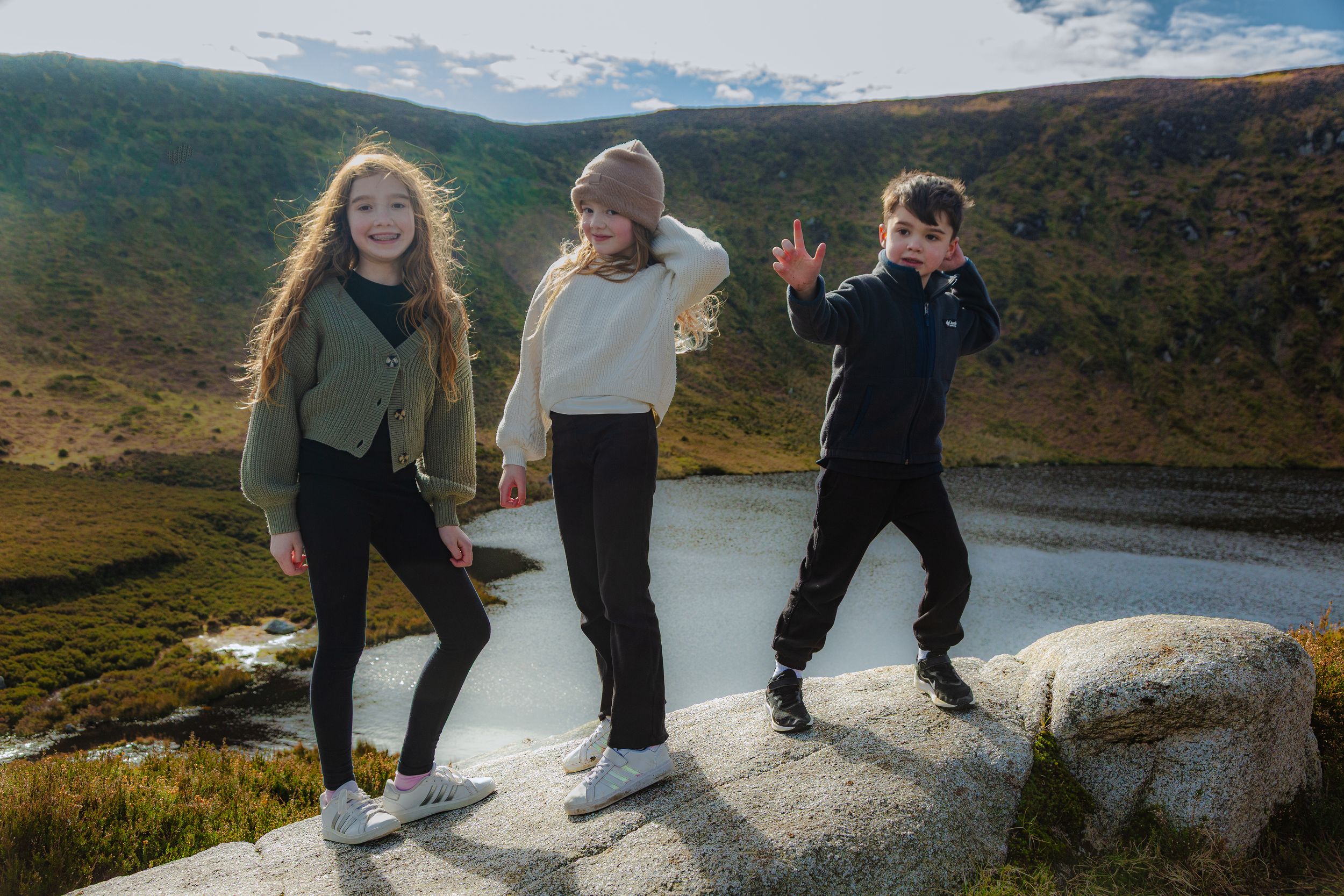 Children exploring the rugged landscape of County Wicklow during a family adventure.