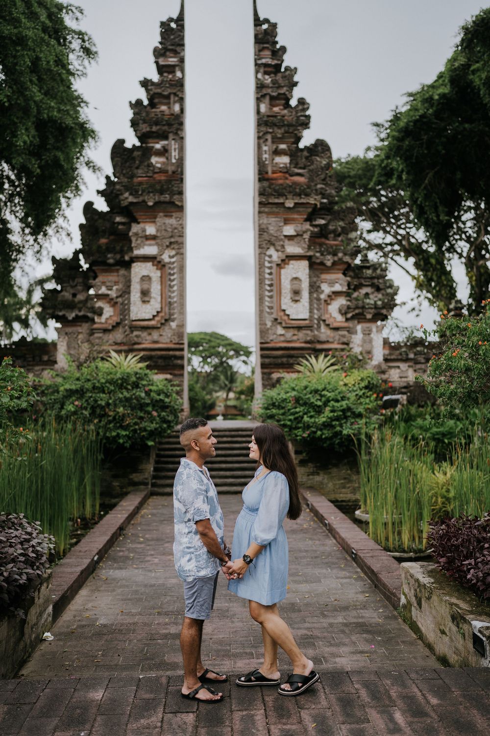 Family photoshoot experience at Nusa Dua Beach Hotel Bali with seaside backdrop.