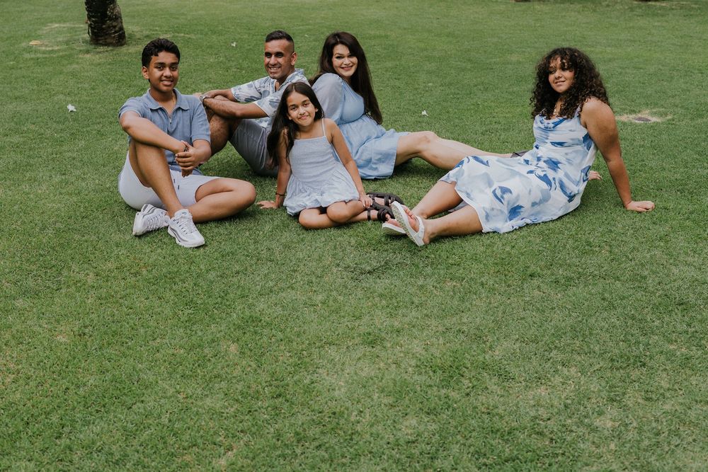 Family photoshoot experience at Nusa Dua Beach Hotel Bali with seaside backdrop.