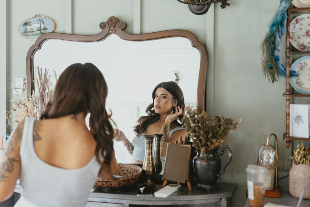 A collection of vintage-style mirrors and decor items arranged on a wall in an elegant interior setting.