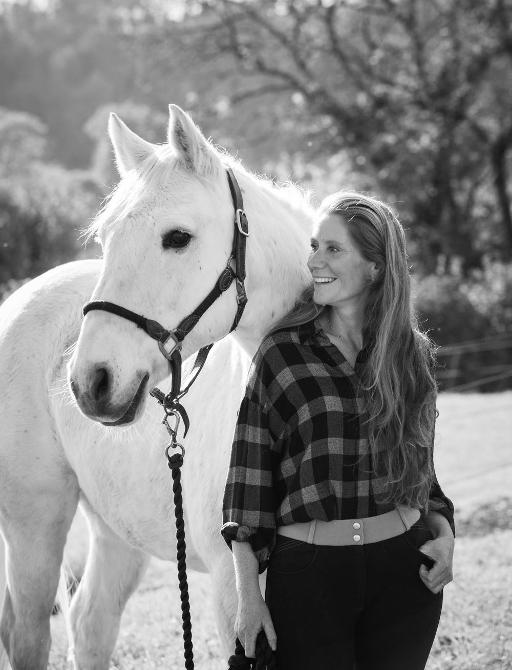 Black and white photo series of a white horse and rider in plaid shirt against natural outdoor backdrop.