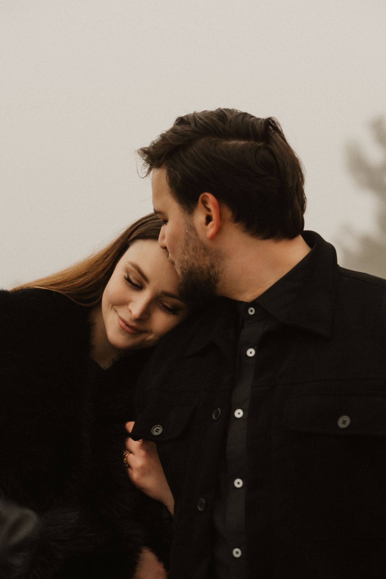 Distant shot of a couple walking on the panoramic paths of Portopiccolo during a foggy day.