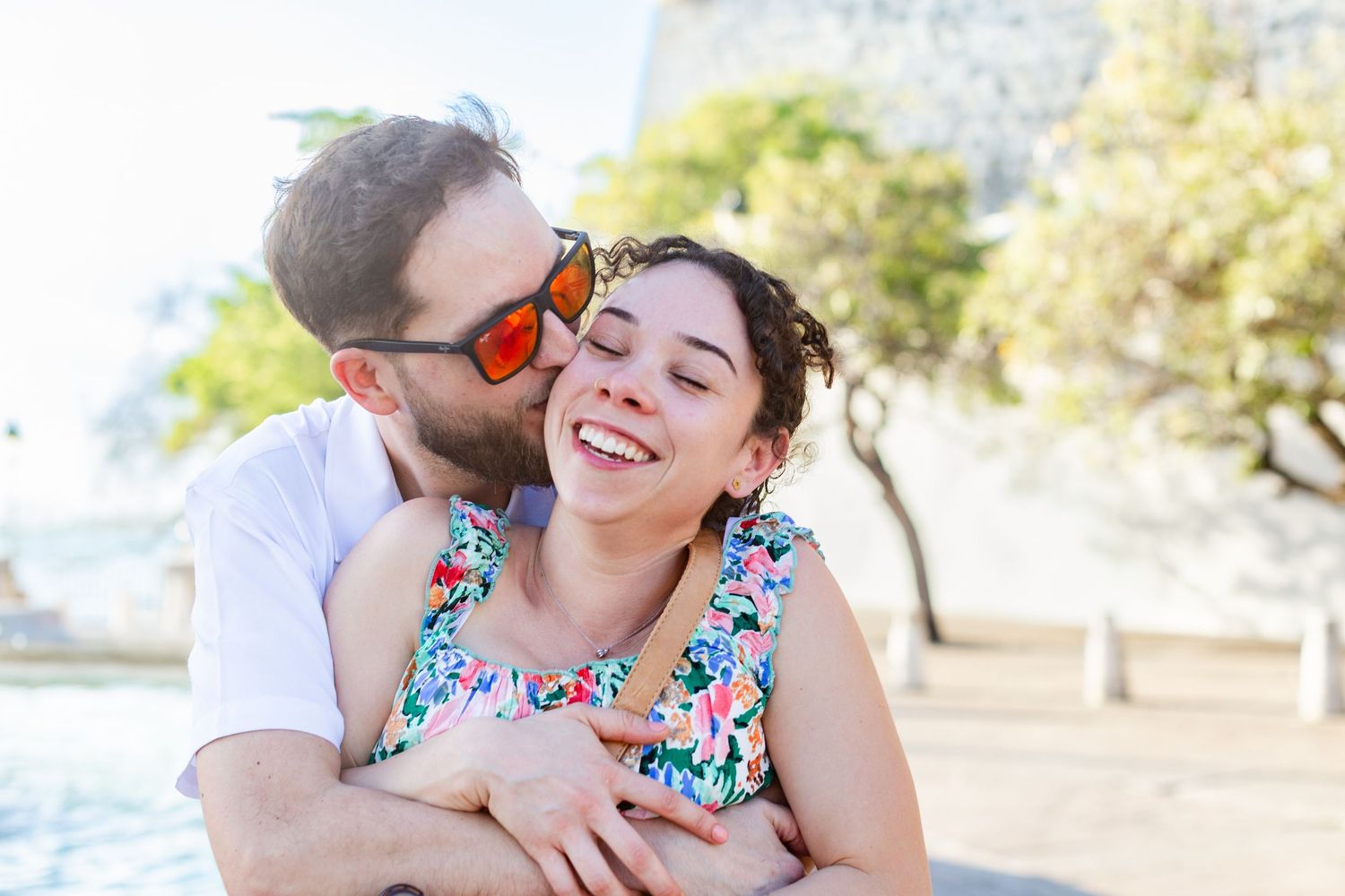 Couples portrait. Marriage proposal at Fuente Raíces in Old San Juan, Puerto Rico.