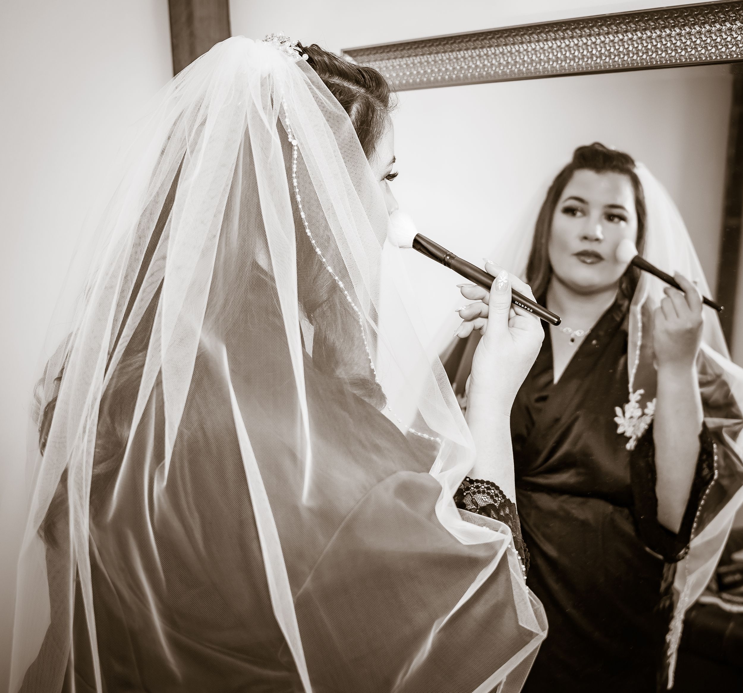 Black and white artistic series of bridal portraits showing flowing veil and dress details.