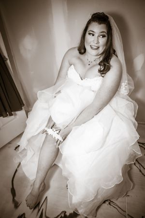 Vintage style sepia wedding portraits featuring elegant bridal poses and flowing gown details.