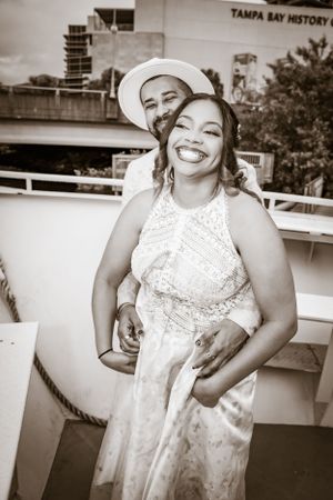 Candid shots at Tampa Bay History museum showing joyful moments in a white lace dress.