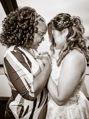 Black and white artistic wedding portrait showing an intimate emotional moment.