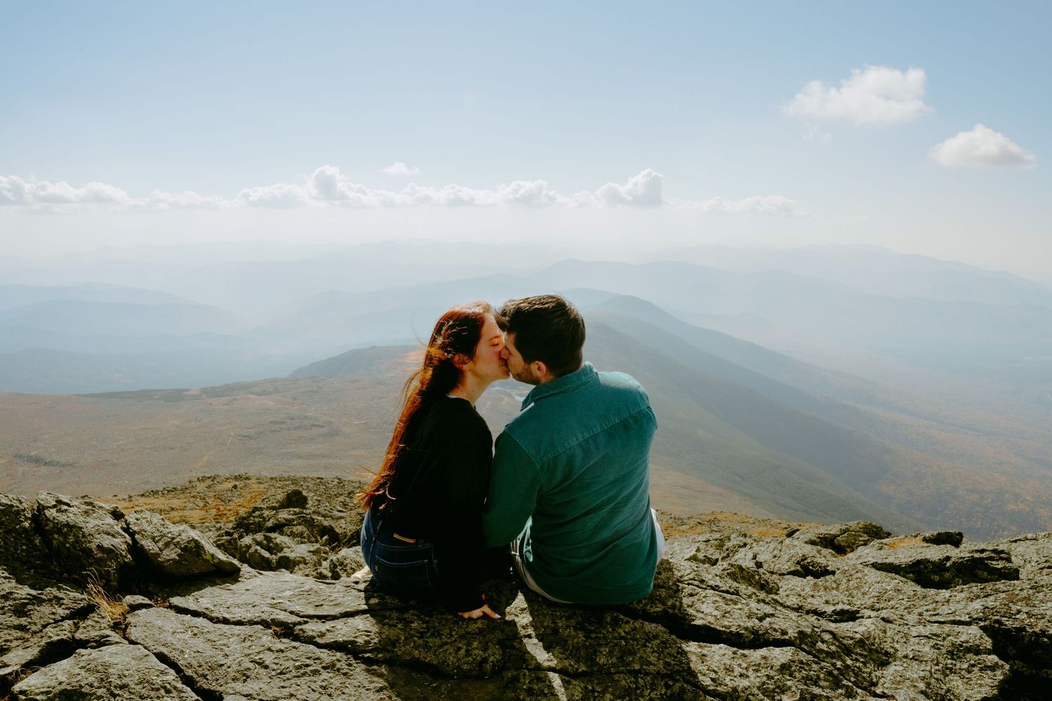 Memory Lane Studios intimate couple moment sitting on Mt Washington mountain peak with panoramic views engagement photography