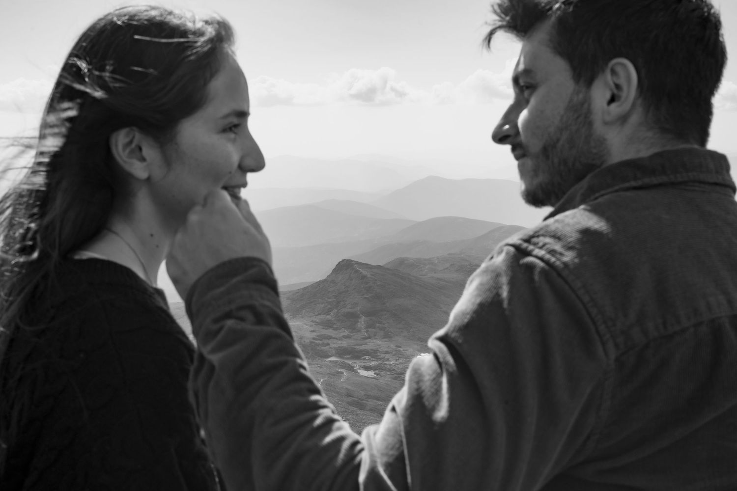 Memory Lane Studios black and white Mt Washington engagement portrait of intimate couple moment on mountaintop by Tharun Palla