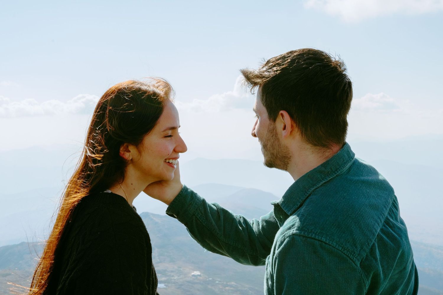 Memory Lane Studios loving couple sharing tender moment against Mt Washington mountainous backdrop engagement session photography