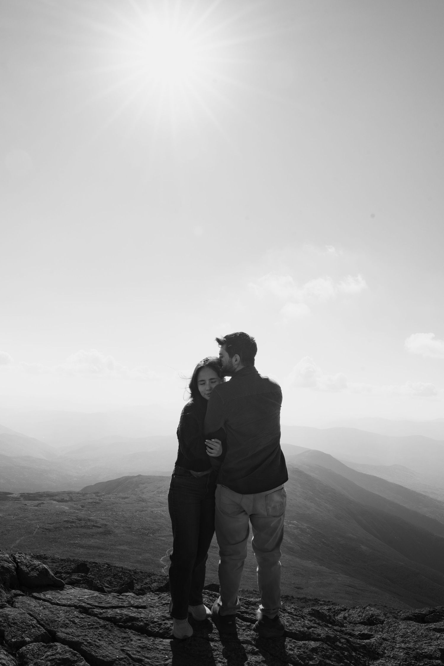 Memory Lane Studios Mt Washington engagement photography with couple silhouette on misty mountain summit by Tharun Palla