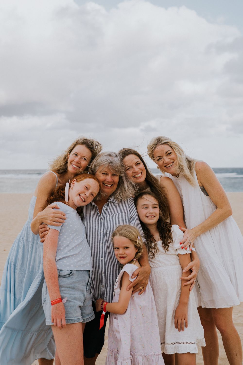 Family holiday photography services with a beach background.