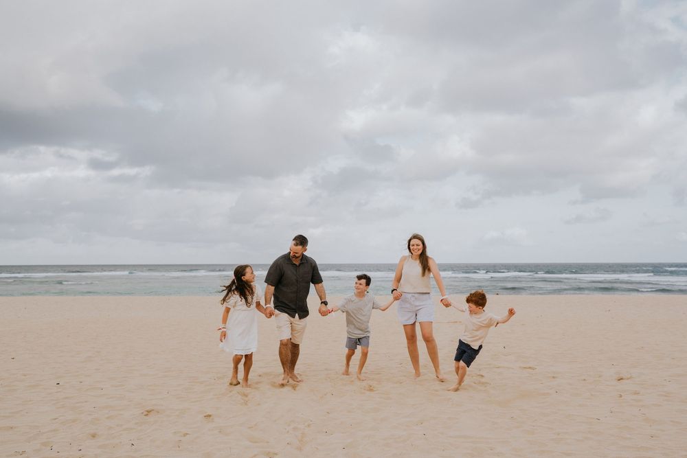 Family holiday photography services with a beach background.