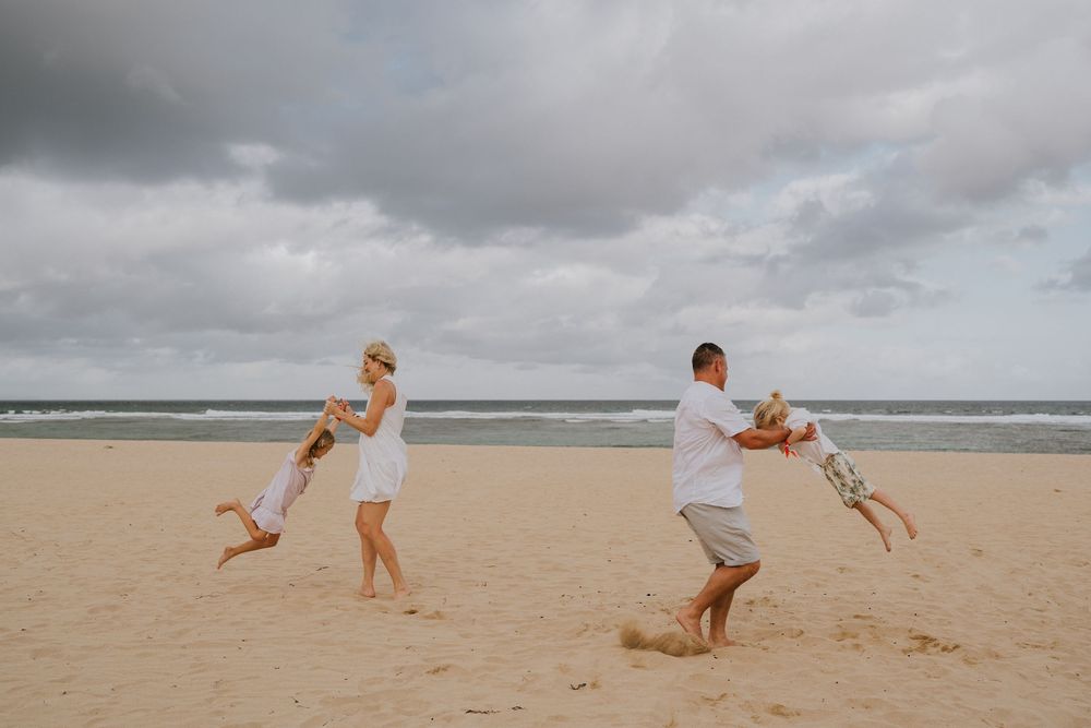 Family holiday photography services with a beach background.