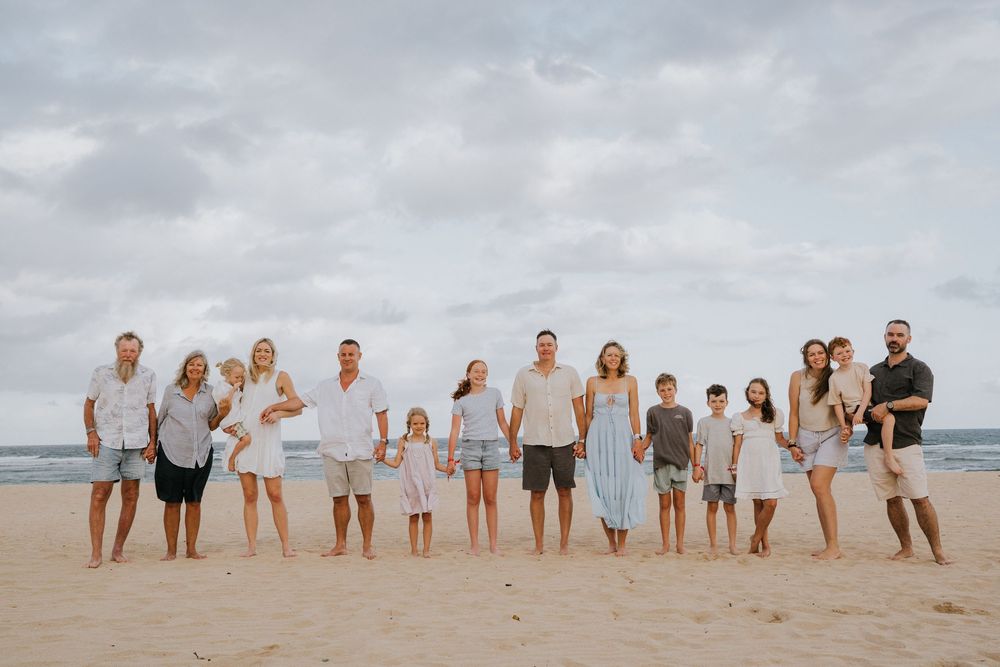 Family holiday photography services with a beach background.