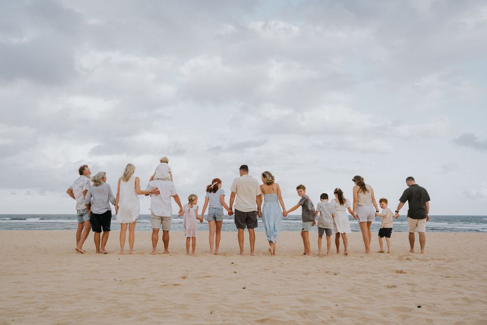 Family holiday photography services with a beach background.