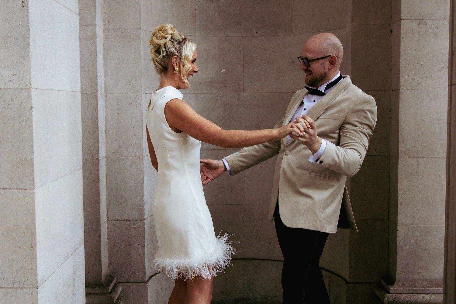 Bride dancing with groom in the alcoves of Old Marylebone Town Hall by Dominique Lauren Photography