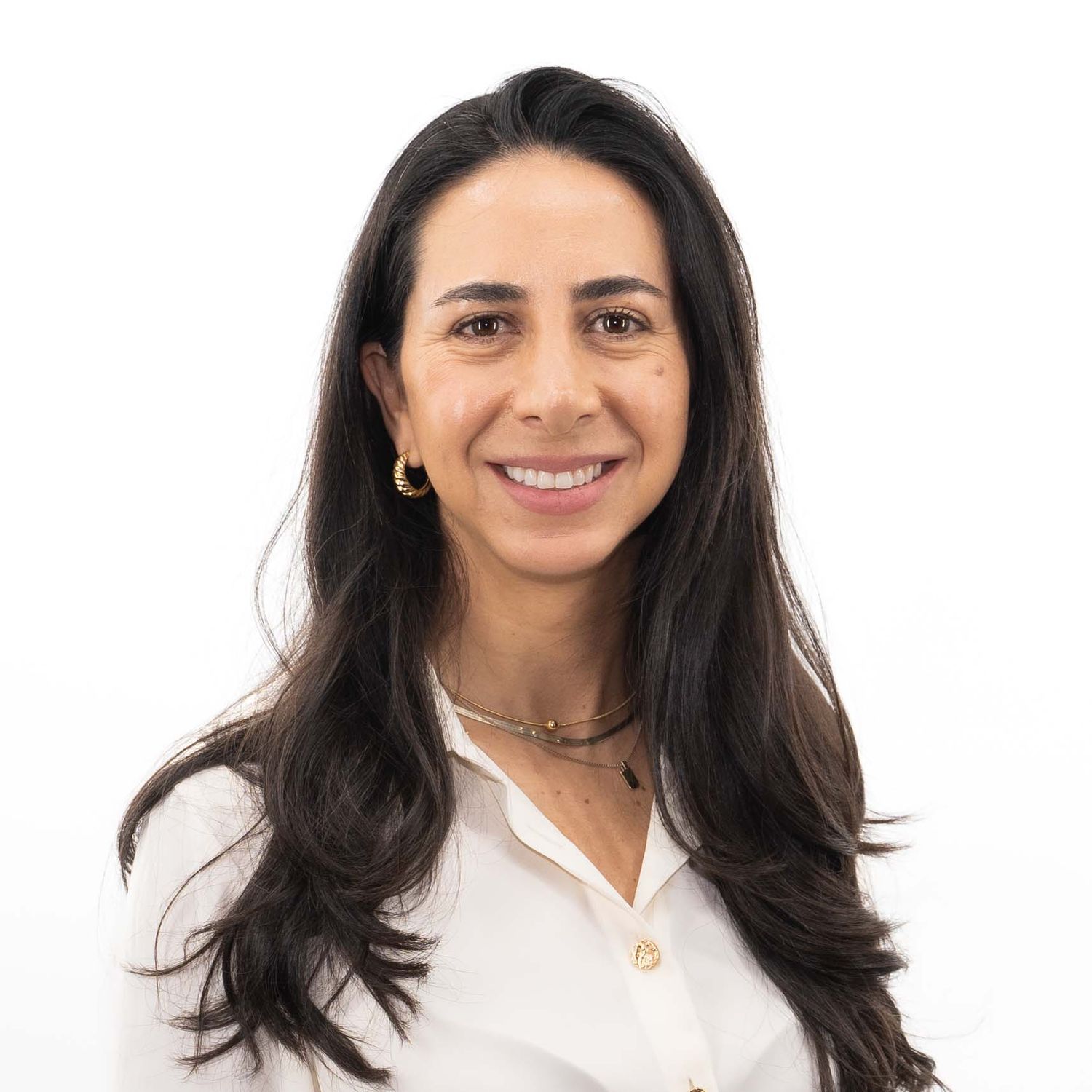Professional headshot series of a person with dark hair wearing a white shirt against a light background.