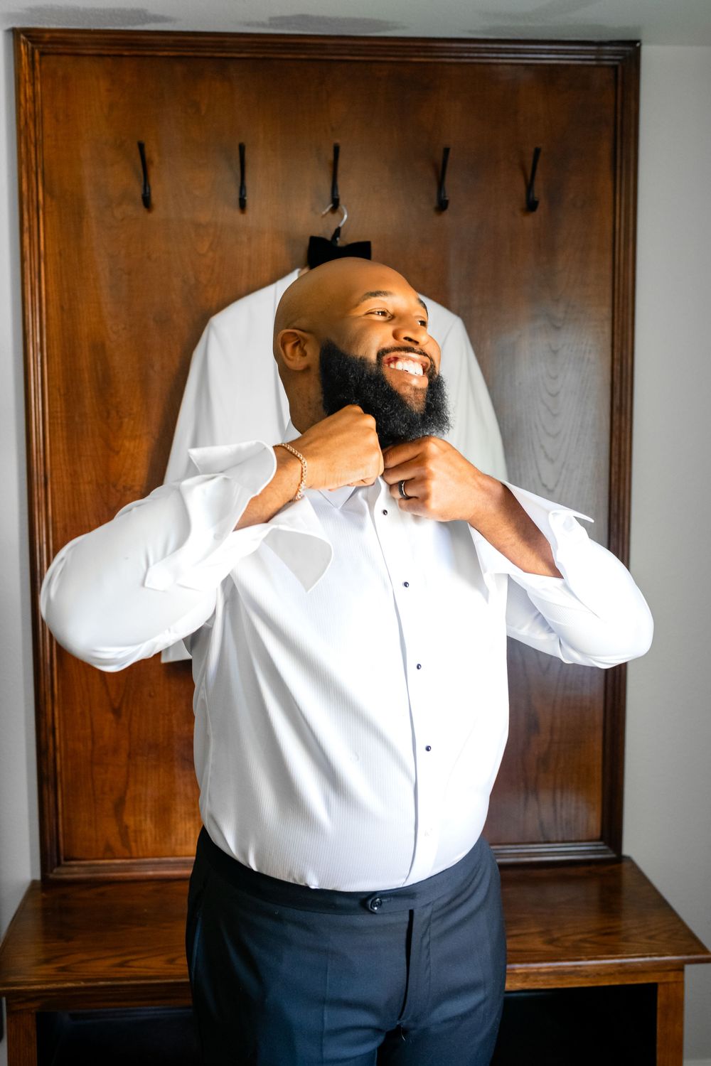 A series of photos showing a person in a white dress shirt and dark pants laughing and expressing joy.