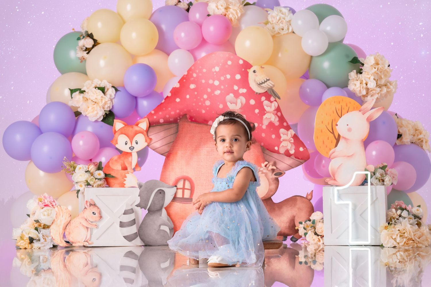 Lion King Smash Cake with smiling baby, themed cake, jungle balloons, and safari decor at ILU Studio Orlando.