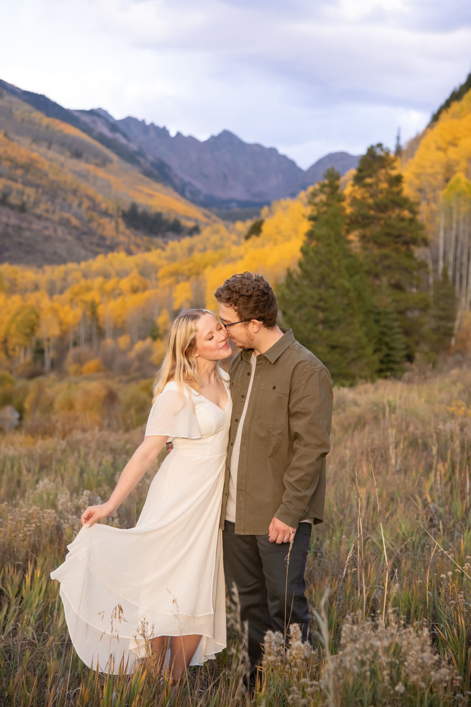 Fall engagement photos in Vail Colorado with golden fall colors and mountain backdrop