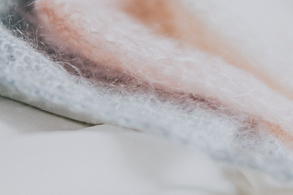 Fresh raw fish fillets arranged in a row showing white flesh and pink undertones.