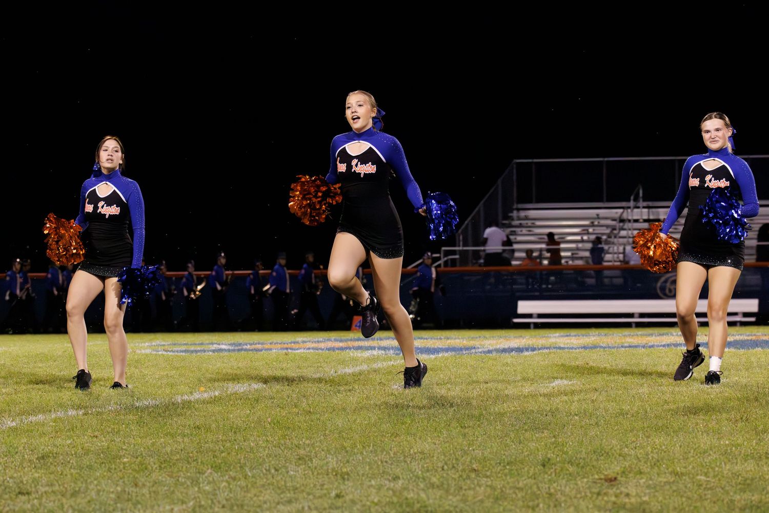 A sequence of action shots shows a volleyball player diving to save the ball on a grassy field during a game.