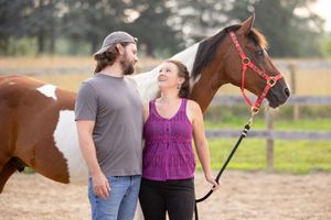 Couple with paint horse at East Creek Stables in Leonard, Michigan