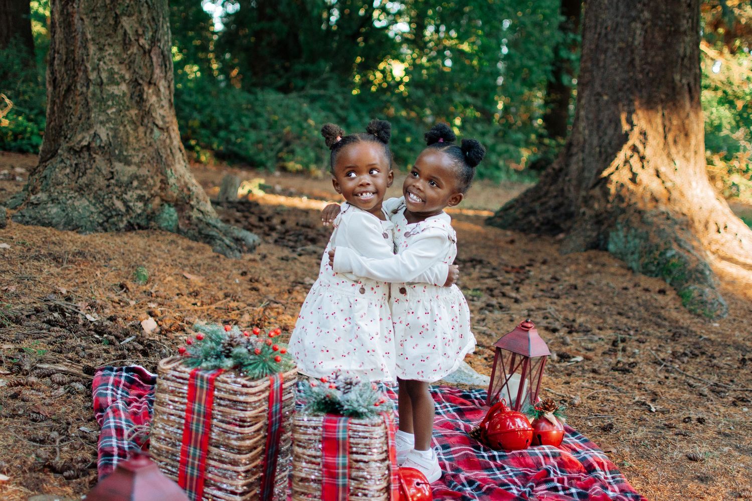 Two children hugging and laughing during a holiday mini session in South King County.
