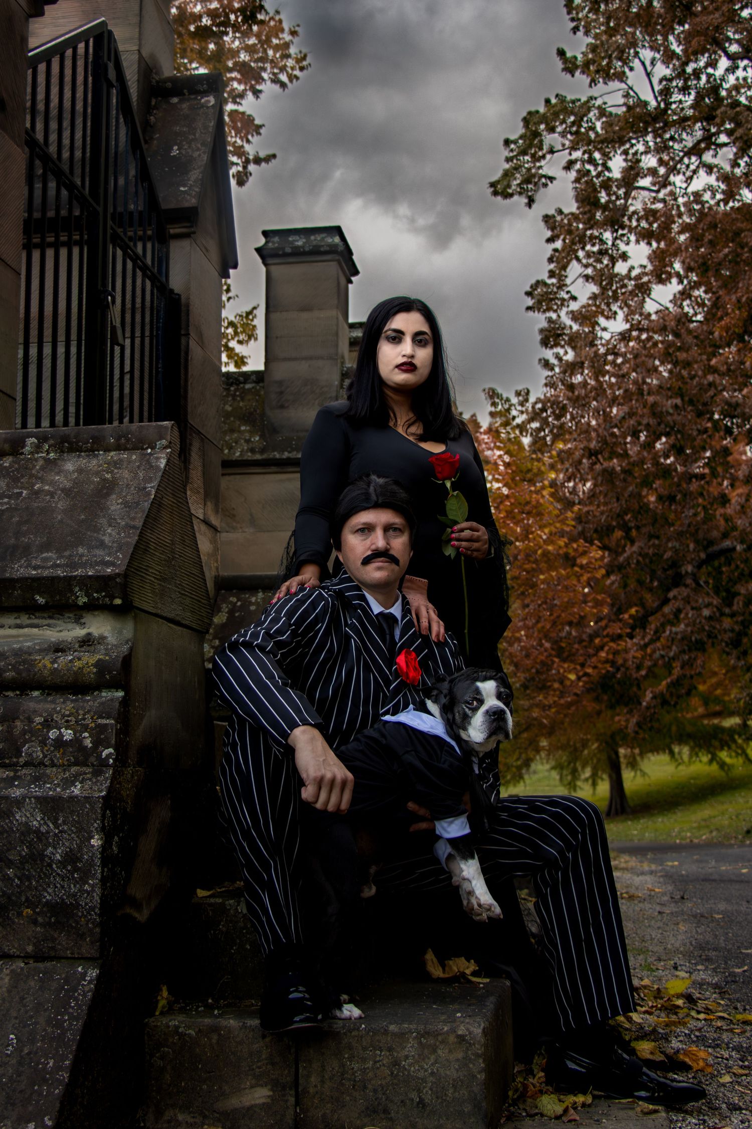 Addams Family Halloween couple photography at Spring Grove Cemetery featuring gothic styling and cinematic graveyard portraits in Cincinnati