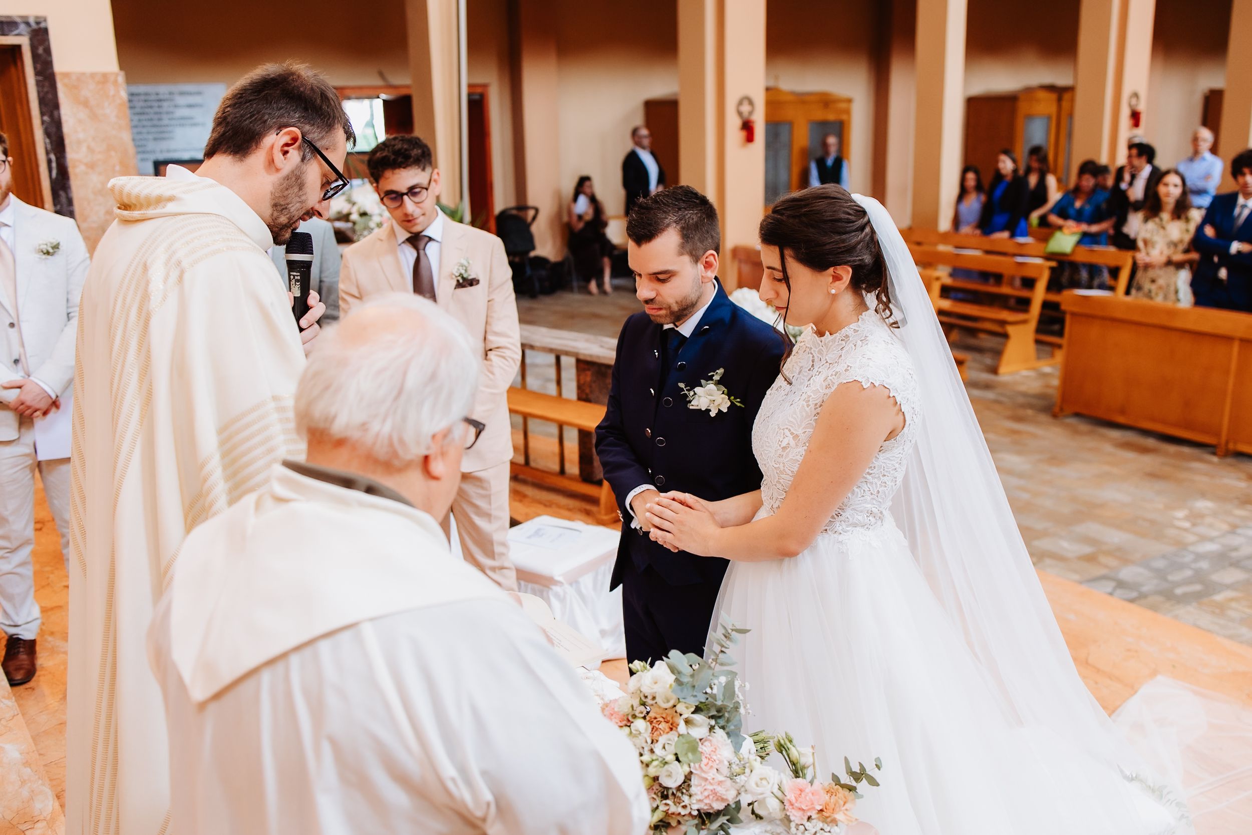 A couple shares an intimate moment during their first dance at an elegant wedding reception.