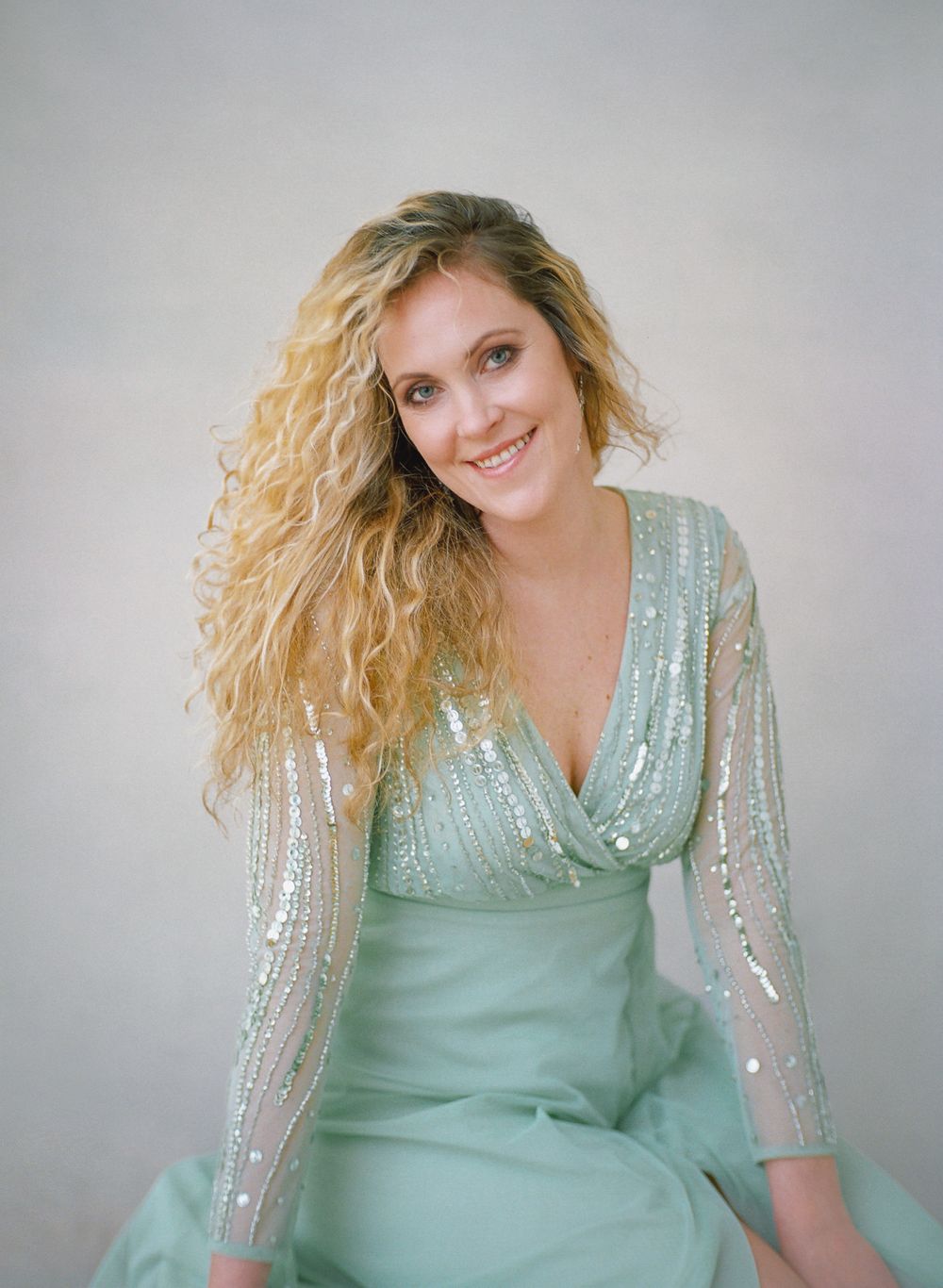 Glamour portrait in shimmering mint green evening dress.