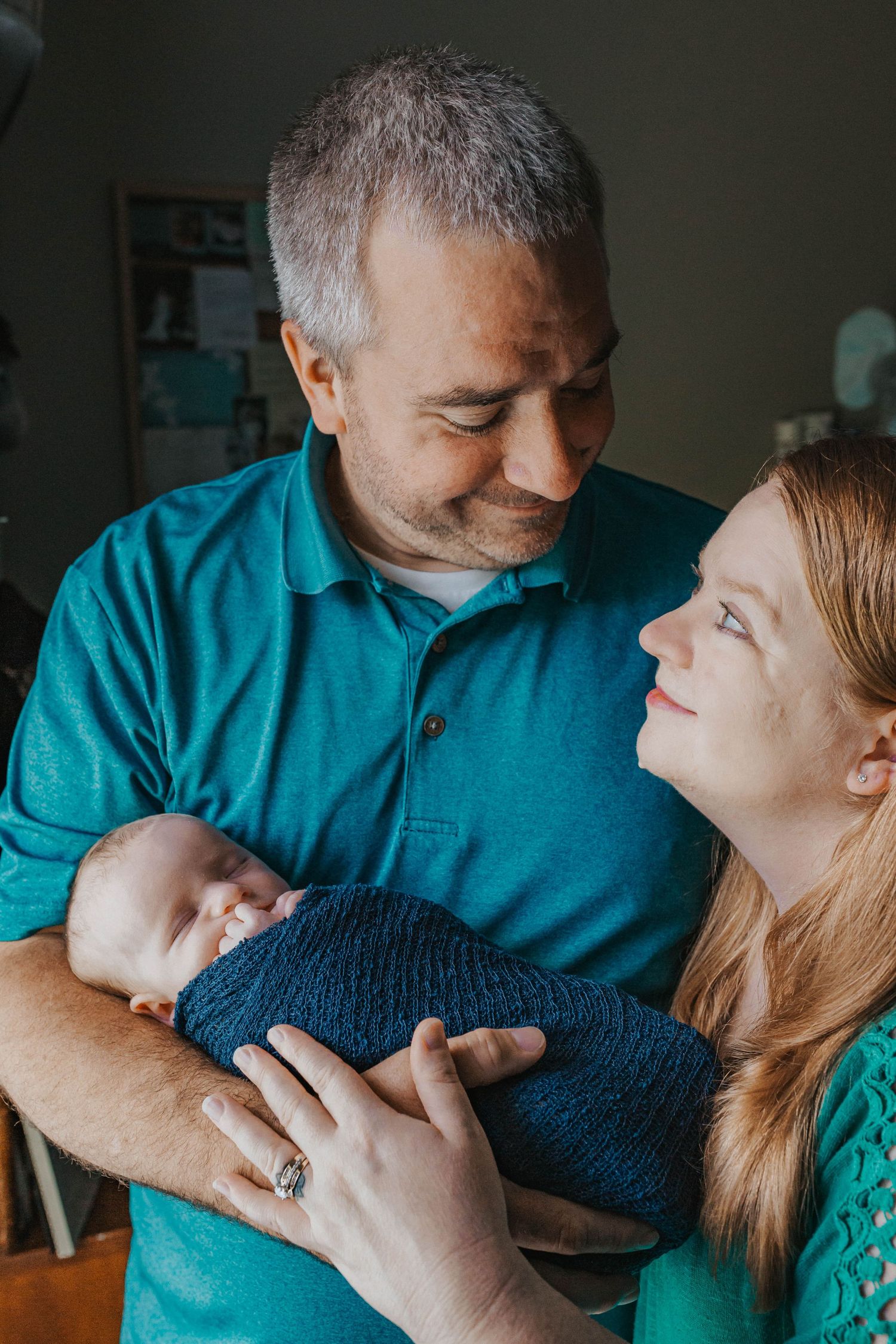 A couple in turquoise and navy share tender romantic moments in a sequence of intimate photos.