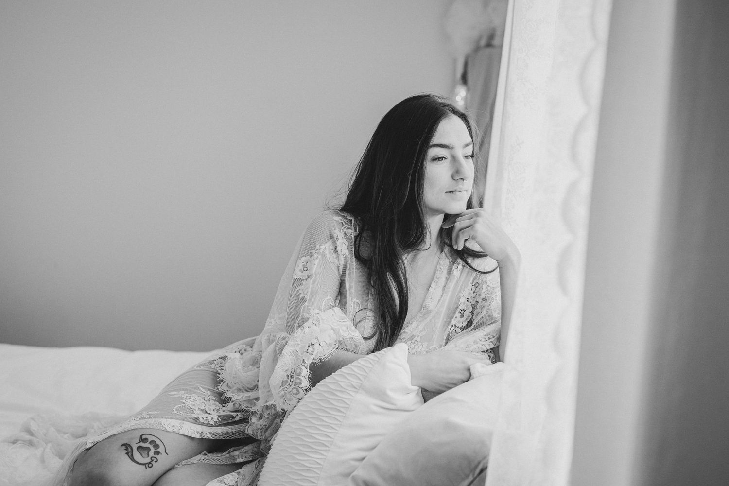 Black and white photo series showing a woman in white dress posing elegantly against a bright window backdrop.