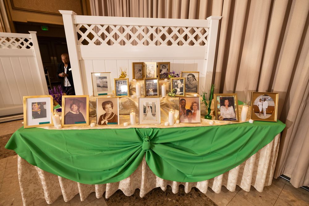 A collage of wedding reception decor photos showing green fabric draping, white lattice, and framed photos on display.