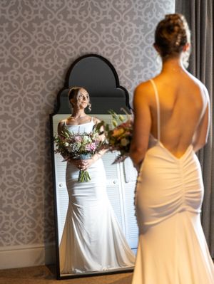 A series of wedding preparation photos showing a bride in a white dress and bridesmaid in yellow against a patterned wall.