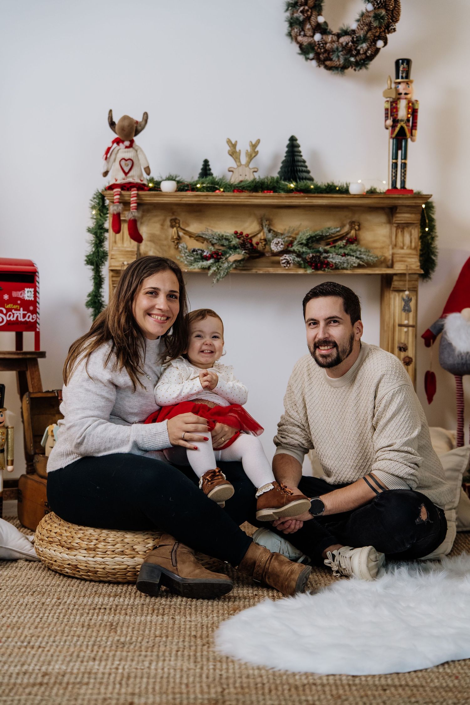 A cozy family Christmas photoshoot sequence showing festive decorations and holiday moments on a carpeted floor.