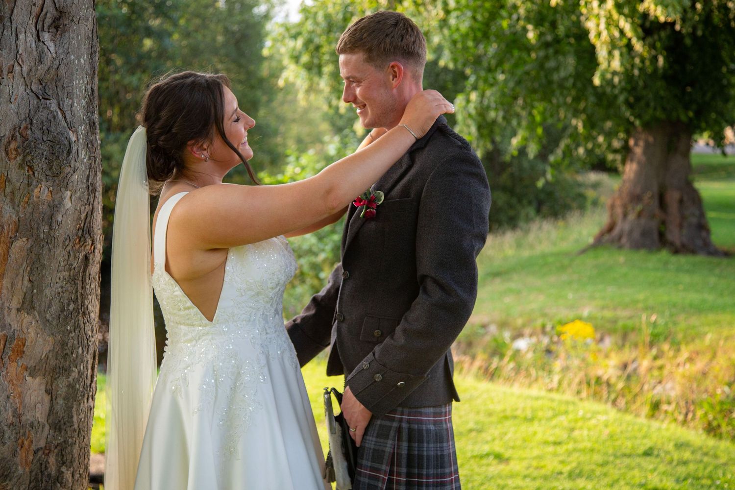 bride and groom looking into each others eyes