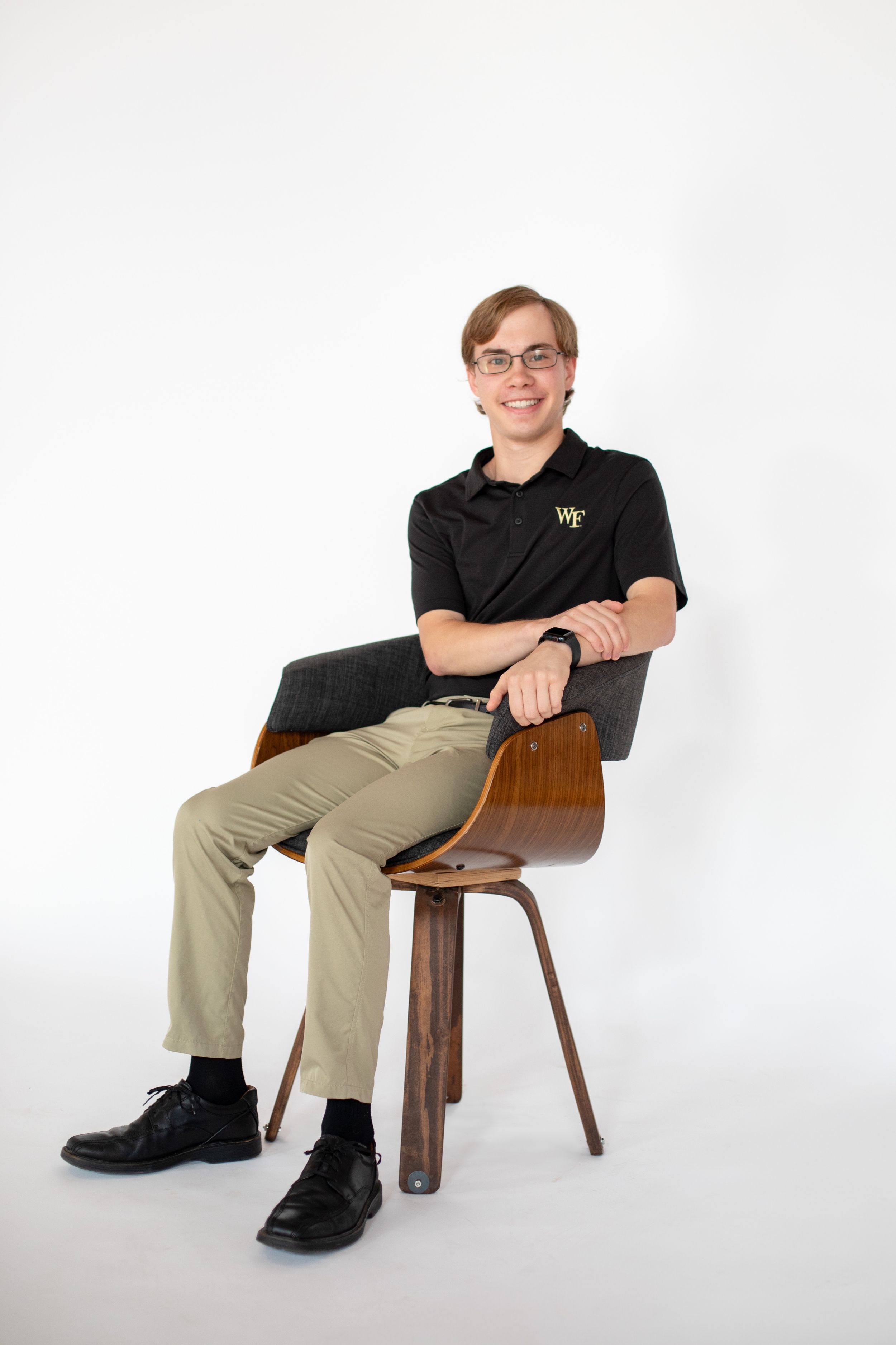 Senior photo of teen in Cincinnati studio with professional lighting and polished styling for high-end portrait clients