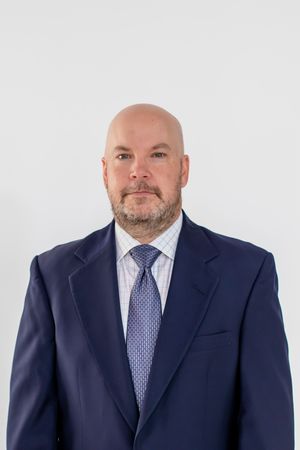 Professional headshot of man at Cincinnati studio with polished lighting and clean background for high-end business and branding clients