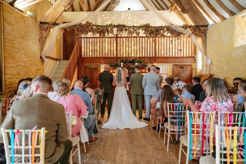 Owlpen Manor wedding photographer Zara Davis Photography Cotswolds Gloucestershire bride and groom during ceremony