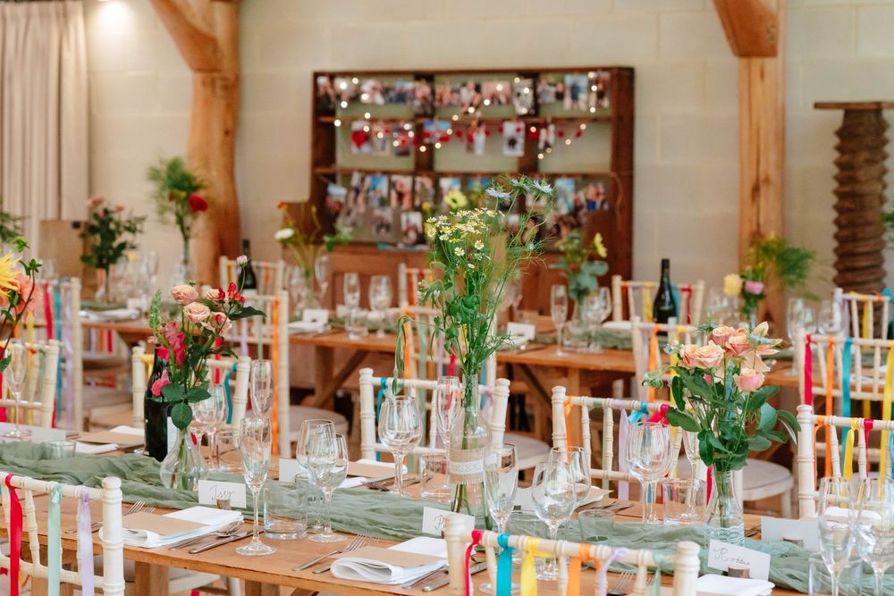 Owlpen Manor wedding photographer Zara Davis Photography Cotswolds Gloucestershire inside barn for wedding breakfast decor