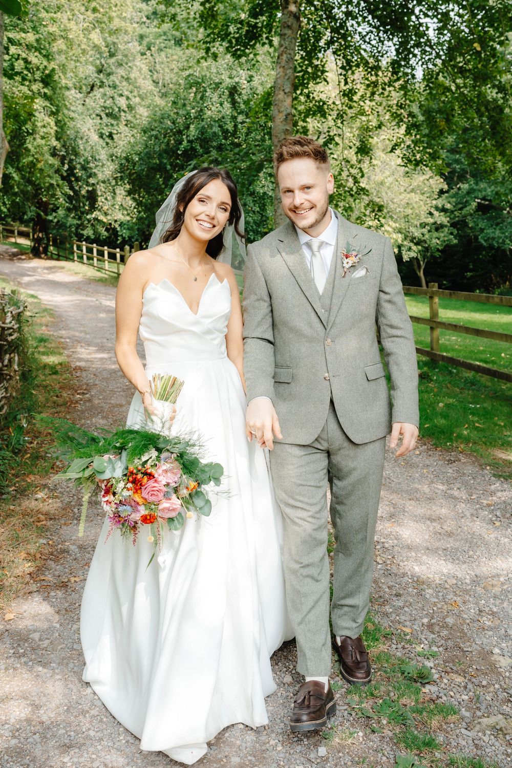 Owlpen Manor wedding photographer Zara Davis Photography Cotswolds Gloucestershire bride and groom natural walk portrait
