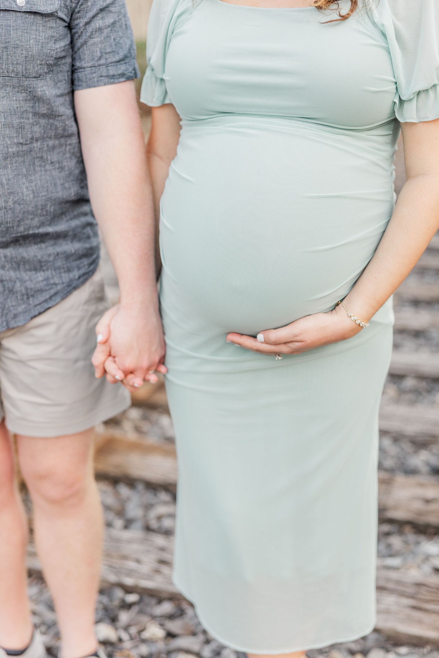A series of close-up shots showing a pregnant belly in a mint green dress against a textured background.