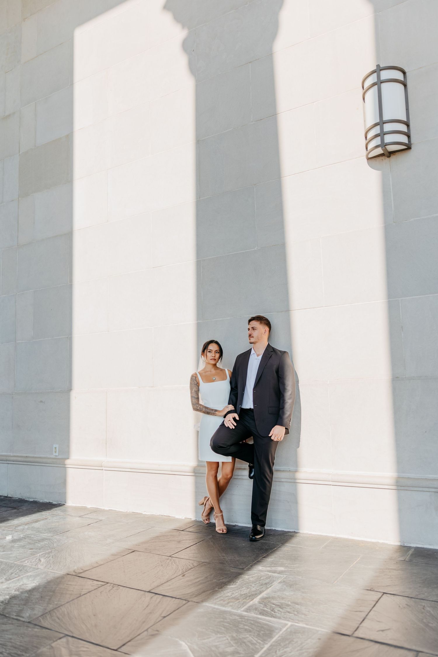 Architectural engagement photos with dramatic shadows and columns.