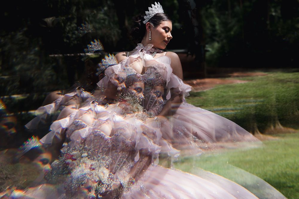 A sequence of photos shows a flowing pink dress twirling gracefully in an outdoor garden setting.