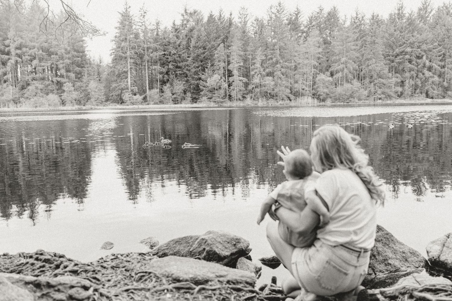 Winter landscape mother holding daughter during family photoshoot