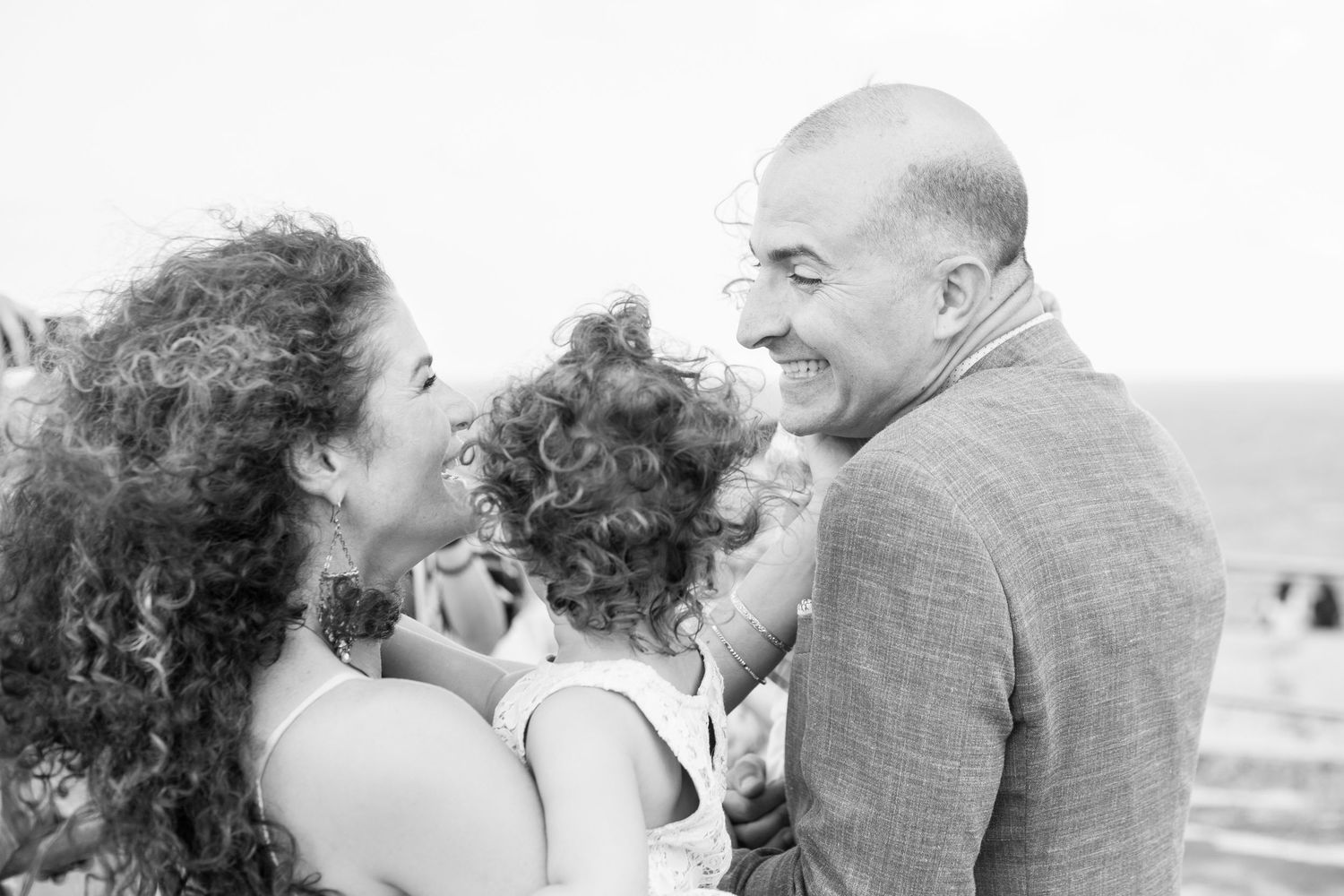 Surprise wedding. Bride, groom, and child. El Morro. Old San Juan, Puerto Rico.
